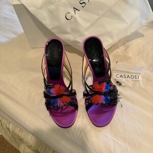 Casadei, they are patent leather with beautiful red and blue black feathers.